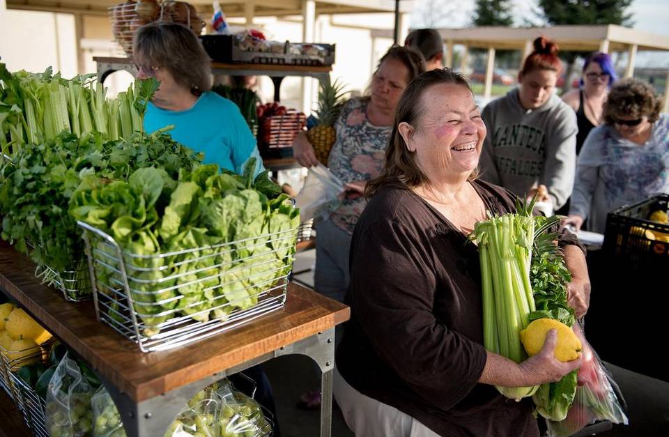 Clients receiving fresh produce at Feed Modesto Free Mobile Farmers Market